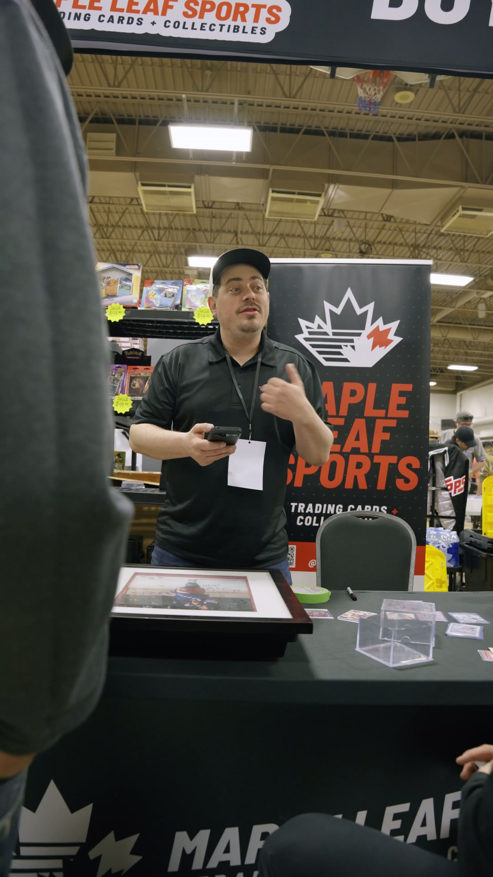 A Maple Leaf Sports vendor at their table